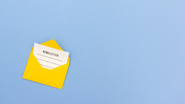 Yellow envelope with paper inside that says "newsletter"