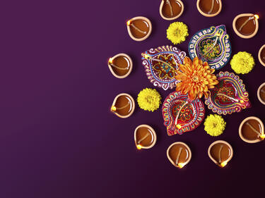 Mandala surrounded by Diwali candles