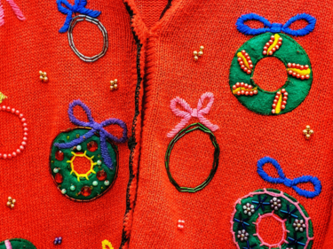Christmas sweater with Christmas wreaths.