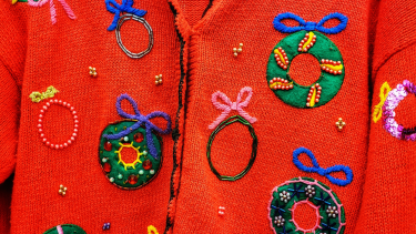 Christmas sweater with Christmas wreaths.