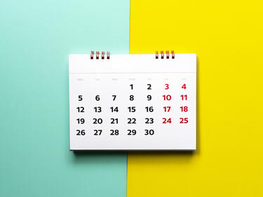 Calendar on a blue and yellow background.