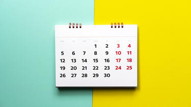 Calendar on a blue and yellow background.