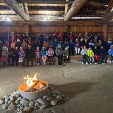 Students at a long house.