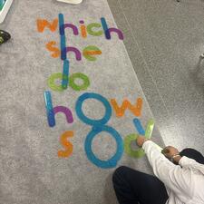 Student using manipulatives to build words.