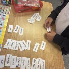 A student sorting words.